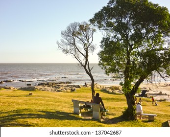 People Enjoying South America Montevideo Beach In Summer.