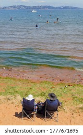 People Enjoying Summer Vacation On The South Devon Coast