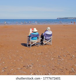 People Enjoying Summer Vacation On The South Devon Coast