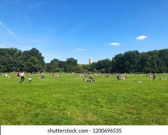 People Enjoying Sun With Picnic At The Central Park 