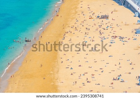 Similar – Aerial View From Flying Drone Of People Crowd Relaxing On Algarve Beach In Portugal