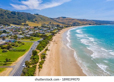 People are enjoying a sunny day on a beach at Apollo Bay, Australia - Powered by Shutterstock