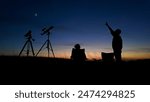 People enjoying watching and stargazing with astronomy telescopes outdoors in nature, observing planets, Moon and other celestial objects.