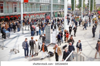 People Enter A Fair Trade Show, Intentionally Blurred Background