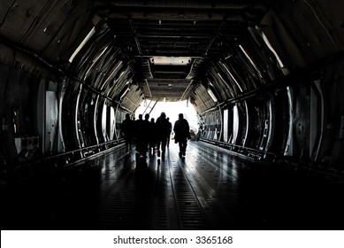 People Entering Cargo Plane