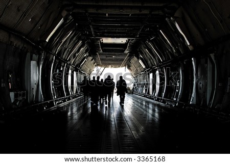 People entering cargo plane