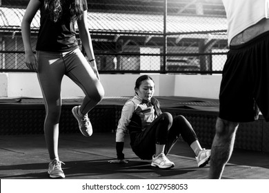 People exercising at fitness gym - Powered by Shutterstock