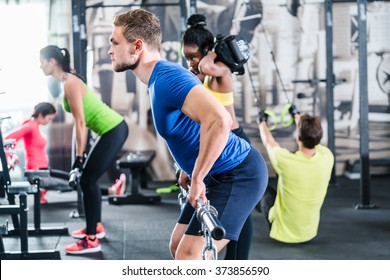 People Exercising In Functional Fitness Gym, Group Of Women And Men