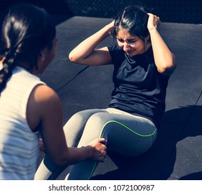 People exercising at the gym - Powered by Shutterstock