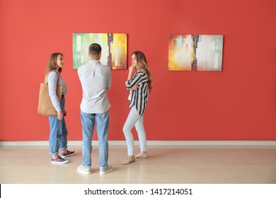 People At Exhibition In Modern Art Gallery