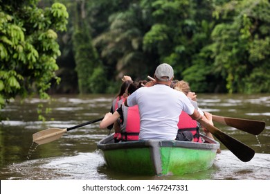 People Exploring A Wild Nature Area By Rowing Boat. Ecotourism Concept. Tortuguero National Park. Costa Rica.