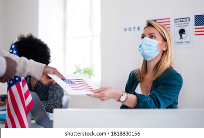 People With Face Mask Voting In Polling Place, Usa Elections And Coronavirus.