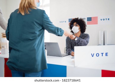 People With Face Mask Voting In Polling Place, Usa Elections And Coronavirus.