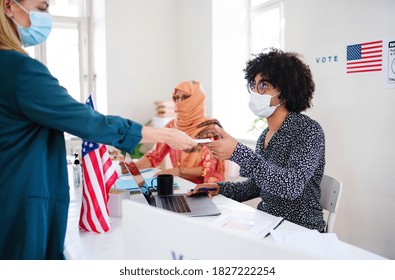 People With Face Masks Voting In Polling Place, Usa Elections And Coronavirus.