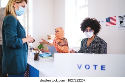 People With Face Masks Voting In Polling Place, Usa Elections And Coronavirus.