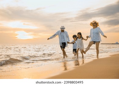 People of father, mother, children son and daughter family of four holding hands together walking outdoor, Happy family having fun running on a sandy beach at sunset, tropical summer travel vacations - Powered by Shutterstock