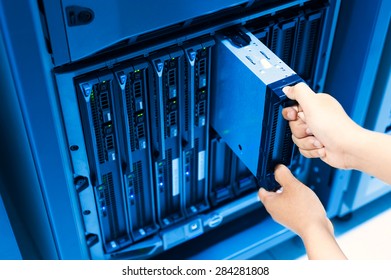 People fix server network in data room .