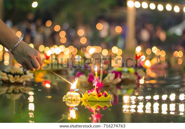 People float lanterns in the river to worship\
river goddess in Loy Kratong\
festival.