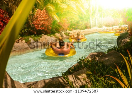 People floating on lazy river in Siam Park, Tenerife, Spain.