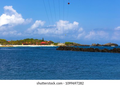 People Flying At High Zipline On Caribbean At Labadee Island At Haiti