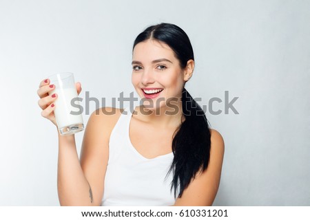 people, food, beauty, lifestyle, fashion and sensitive concept - Milk - Woman drinking milk, happy and smiling beautiful young woman enjoying a glass milk