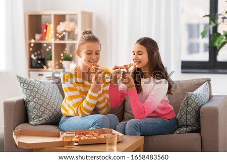 Similar – Image, Stock Photo Sisters, teenage girl and her younger sister pushing hay bale playing together outdoors in the countryside