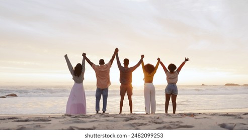 People, friends and holding hands on beach for freedom, outdoor adventure and happiness on summer vacation. Carefree, back and youth together with seaside fun, united and group on holiday for weekend - Powered by Shutterstock