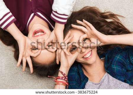 Similar – Sisters, teenage girl and her younger sister pushing hay bale playing together outdoors in the countryside