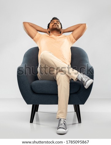 Similar – Image, Stock Photo Young man relaxing on the sofa with a laptop