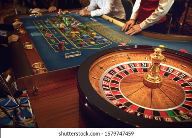 People gambling at roulette poker in a casino.