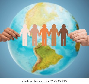 People, Geography, Population And Peace Concept - Close Up Of Human Hands With Earth Globe Showing American Continent Over Blue Background