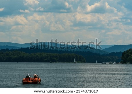 people go out on the lake on a pedal boat