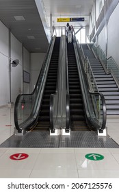 People Going Up With Escalator