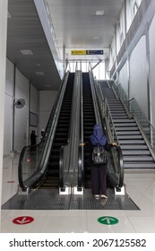 People Going Up With Escalator