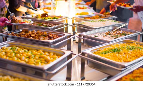 People group catering buffet food indoor in luxury restaurant with meat colorful fruits and vegetables.