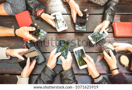 People group having addicted fun together using smartphones - Detail of hands sharing content on social network with mobile smart phones - Technology concept with millennials online with cellphones 