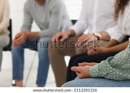 People at group therapy session indoors, closeup