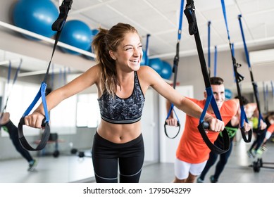 People At Gym Doing Elastic Rope Exercises At Cross Fit Room, Suspension Training