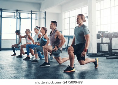 People, gym and lunges for fitness workout together, group and health club training for leg strength. Strong body, balance and exercise determination with posture, collaboration and challenge - Powered by Shutterstock