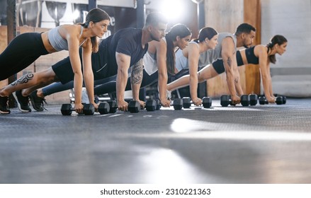 People in gym, plank with dumbbell and fitness, exercise class for muscle training and bodybuilding. Strong, men and women workout together, challenge and motivation with bodybuilder group and power - Powered by Shutterstock