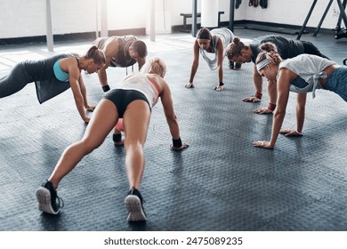 People, gym and push up exercise for wellness in health club, fitness workout and strength for muscles with group. Challenge, body and core power for abdominal training, determination and endurance - Powered by Shutterstock