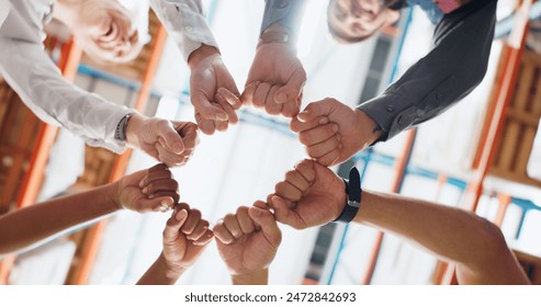 People, hands and fist bump in workplace for teamwork, collaboration and solidarity with synergy. Employee, circle and trust for strategy, partnership with support, diversity and mission in warehouse - Powered by Shutterstock