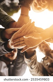 People, hands and outdoor stack for support, love and bonding for united community in nature. Friends, palm and pile in low angle for trust in relationship, solidarity and together on vacation fun