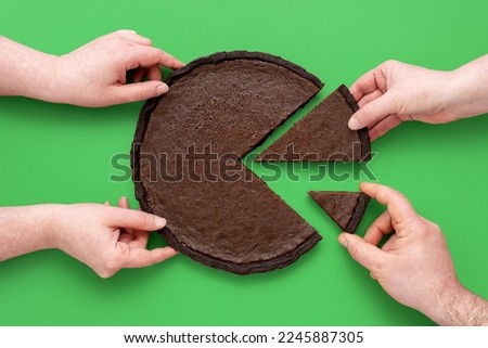 People hands taking slices of chocolate pie, above view on a green background. Unequal sharing the cake, concept for financial pie chart