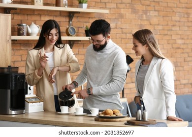 People Having Coffee Break In Office