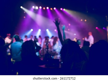 people having fun in a disco. blur effect for an artistic touch - Powered by Shutterstock