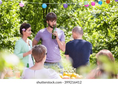 People Having Fun On Summer Garden Party