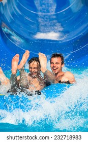 People Having Fun, Water Sliding At Aqua Park.