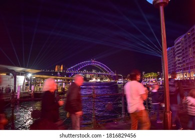 People Having A Walk With The Sydney Harbour Bridge View.