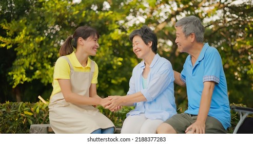 People Healthcare Concept - Asian Senior Woman Thanks To Health Worker When Husband Taking Of Her In The Park